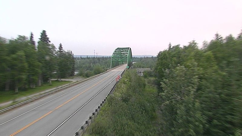 Smoke from the Clear Fire covers the sky above the Rex Bridge along the Parks Highway at Mile...