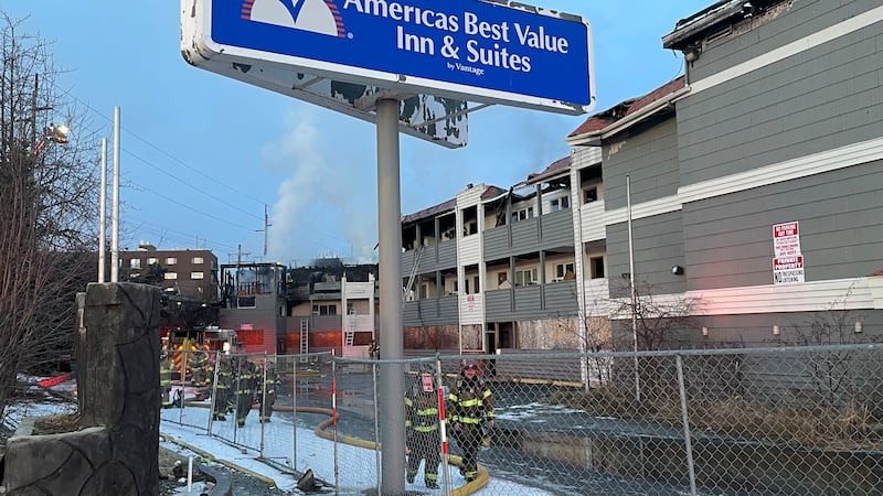 Firefighters rescue 4 people from the top floor of an abandoned building that caught fire...